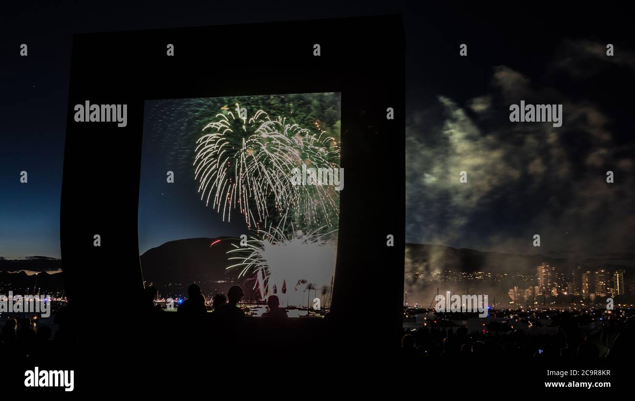 Nighttime long exposure fireworks in Kitsilano Beach Vancouver, BC, Canada Stock Photo