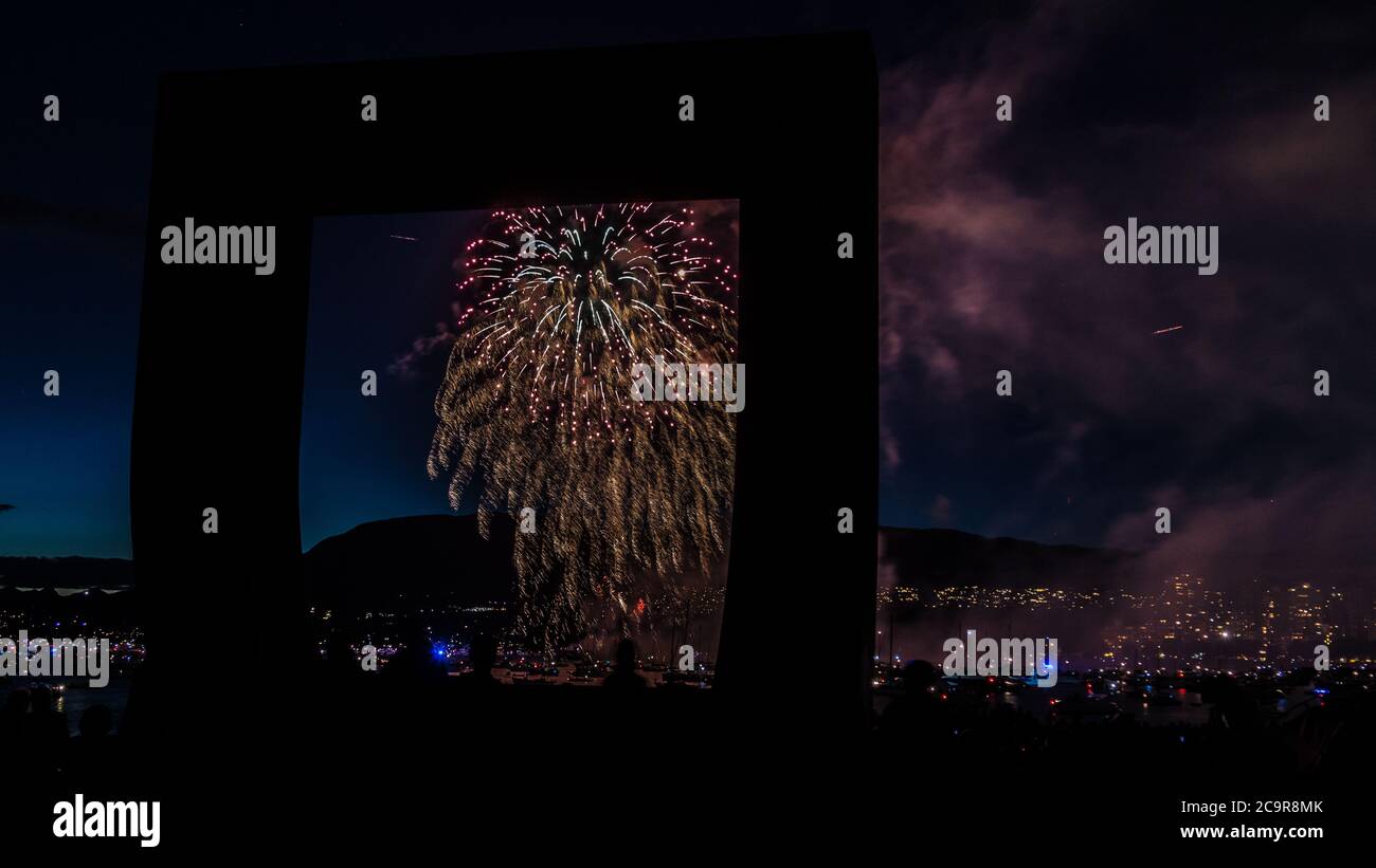 Nighttime long exposure fireworks in Kitsilano Beach Vancouver, BC, Canada Stock Photo
