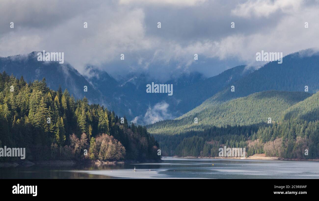 A scenic View of Cleveland Dam reservoir surrounded by mountains, North Vancouver, Canada Stock Photo