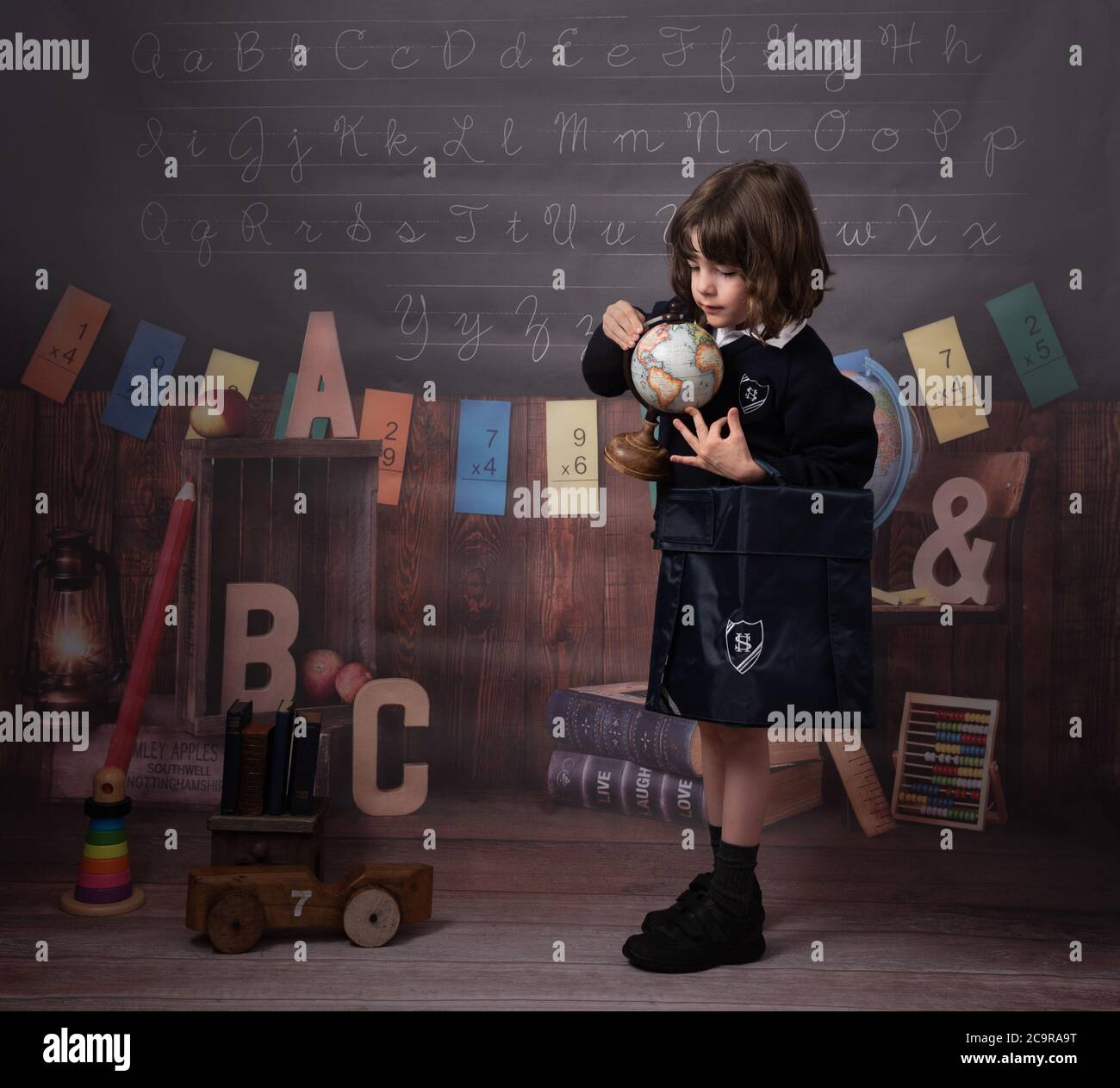 Back to school, Firstgrader, Schoolsback, Schoolboy, Classroom, Boywithapple , Childwithglobe, Schooldesk Stock Photo