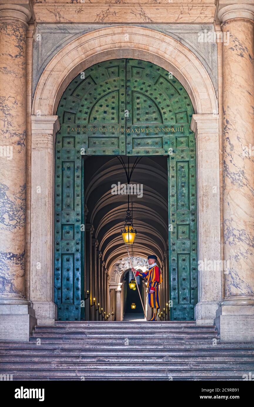 Vatican City, Rome, Italy - August 17: Saint Peter's Basilica. Swiss army soldier in traditional uniform guarding the Vatican Stock Photo