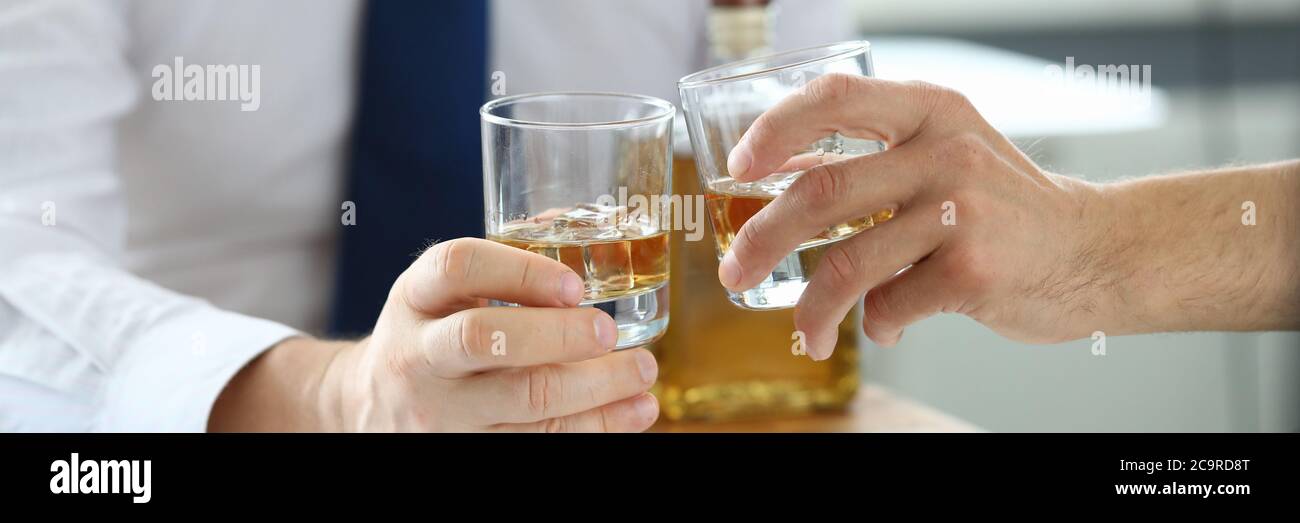 Businessmen in suits drinking alcohol Stock Photo - Alamy