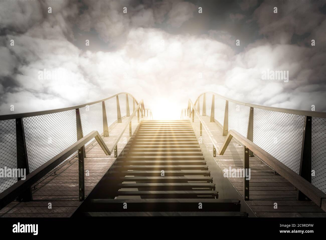 The stairs to the heaven. Up the stairs. Condolence card. Empty place for emotional, sentimental text or quote. Black and white image with golden sunb Stock Photo