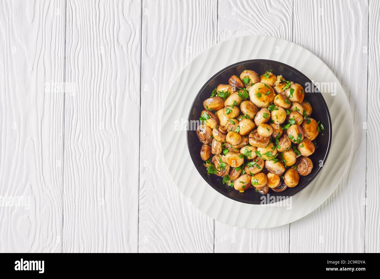 Spanish sauteed garlic button mushroom al ajillo roasted garlic