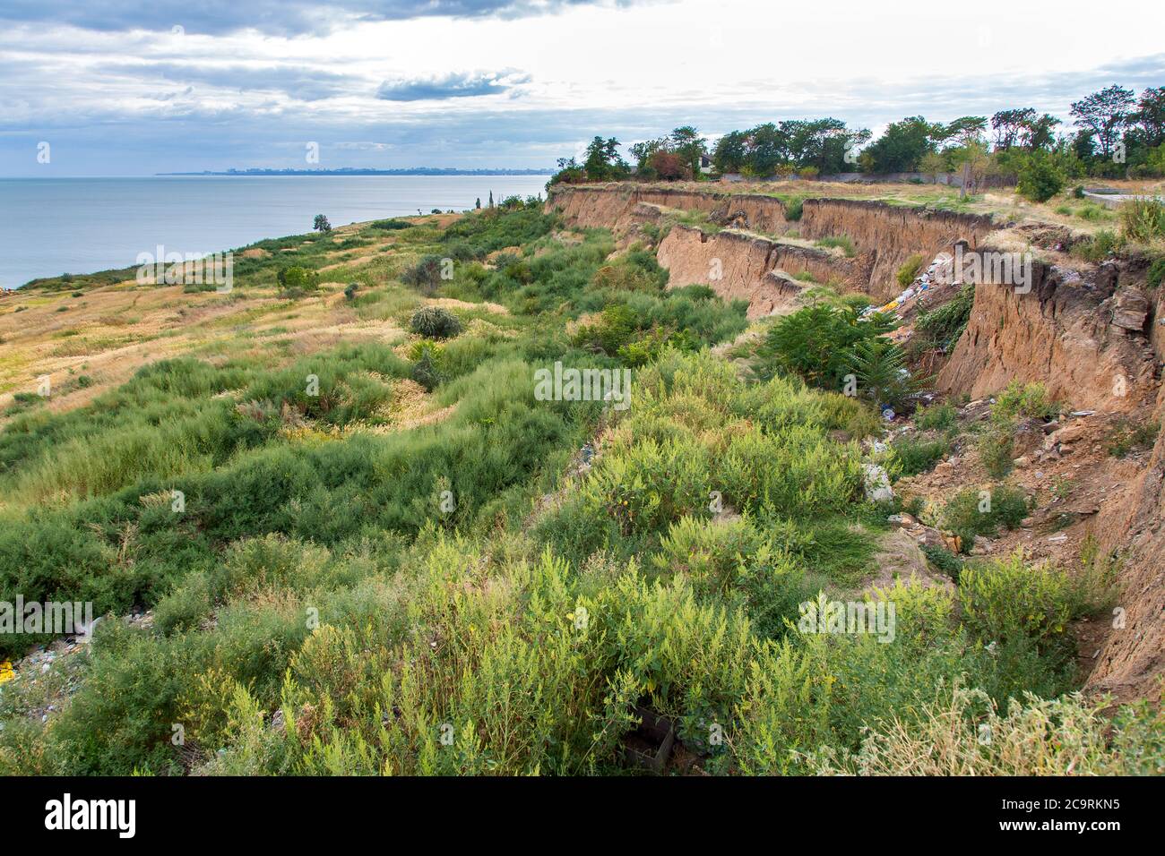 Soil landslide on slopes after degradation of the soil rain or underground water and an earthquake. Stock Photo