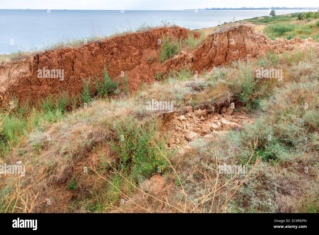 landslides of soil on the coast, clay layers of the earth slide down