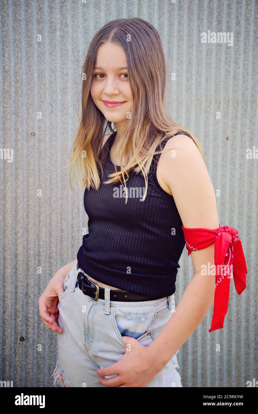 Vintage retro portrait of a girl wearing red bandanna and black tank top Stock Photo