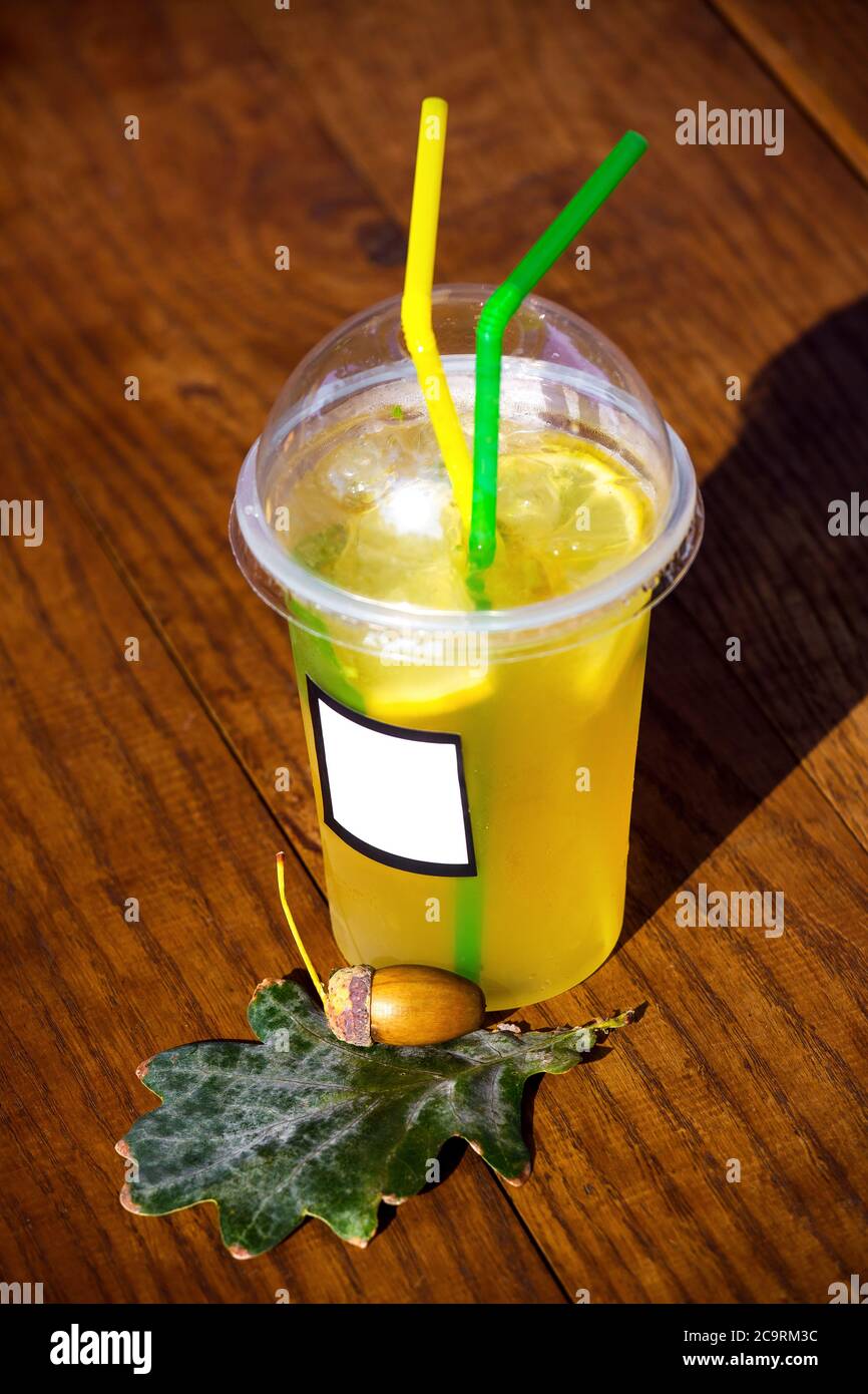 Cold Lemon Iced Tea in Take Away Plastic Cup with Straw and Condensed Water  Droplets on Outside Surface, Summer Refreshing Drink Stock Image - Image of  slice, cold: 113167249