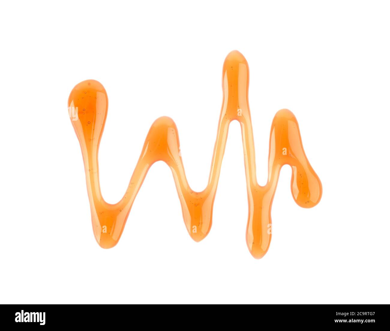 Maple syrup drizzle isolated on white background. Splashes of sweet