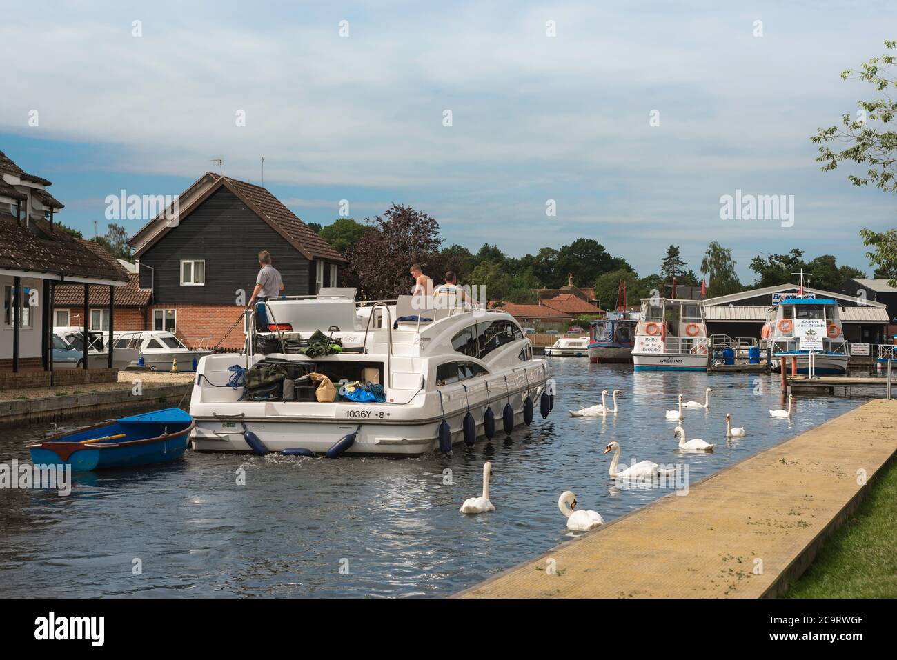 Wroxham Norfolk Broads, view of a pleasure boat sailing in a waterway