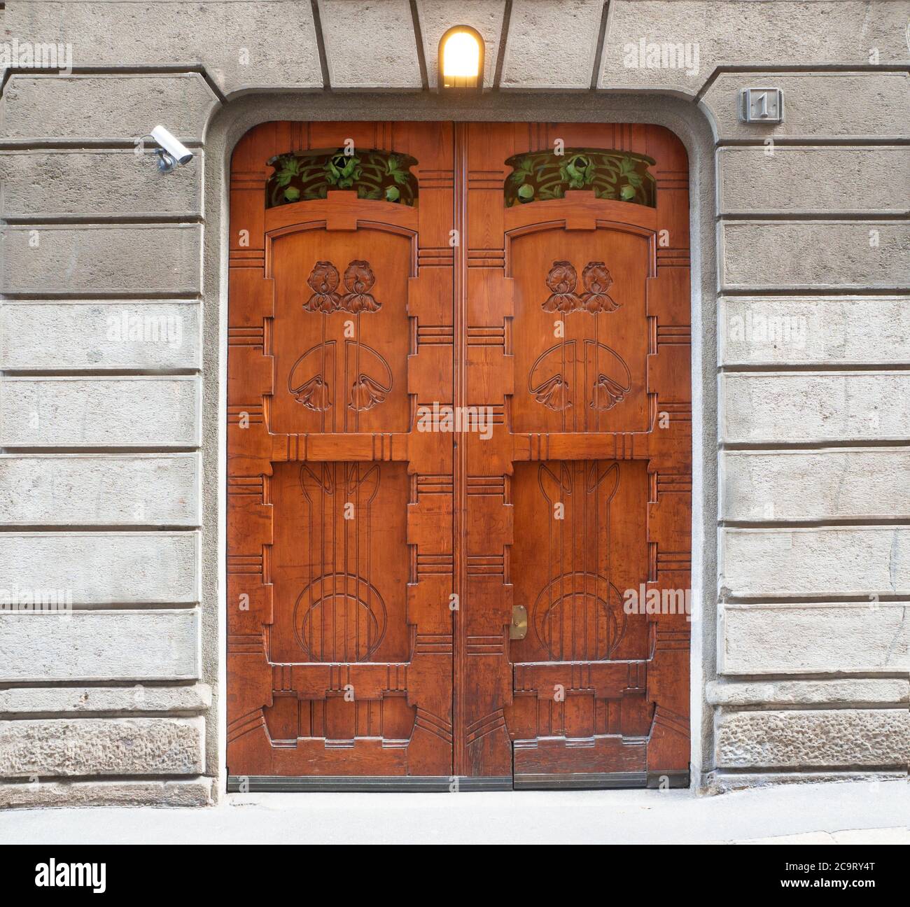 luxury entrance door of a italian building at number one of a street in