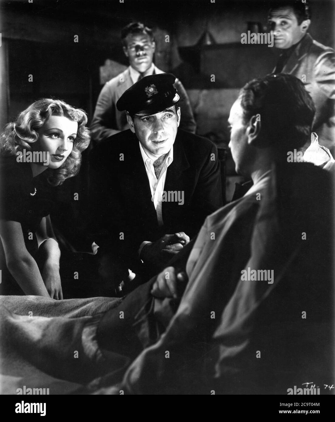 DOLORES MORAN HUMPHREY BOGART WALTER SZUROVY and MARCEL DALIO in TO HAVE AND HAVE NOT 1944 director HOWARD HAWKS novel ERNEST HEMINGWAY screenplay JULES FURTHMAN and WILLIAM FAULKNER Warner Bros. Stock Photo