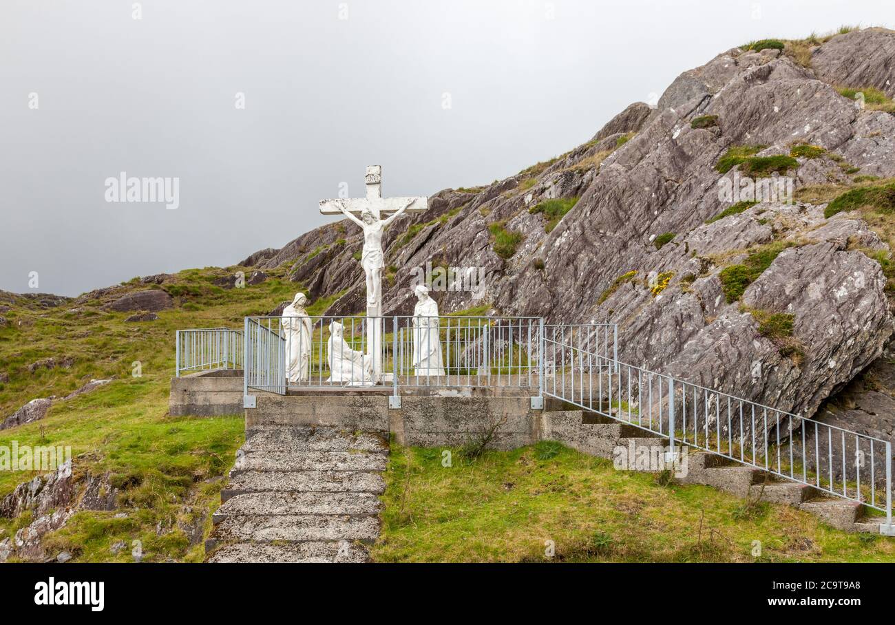 Healy Pass, Cork, Ireland. 01st August, 2020. A statue of the crucifixion at the summit of the Healy Pass in West Cork, Ireland. Credit; David Creedon Stock Photo