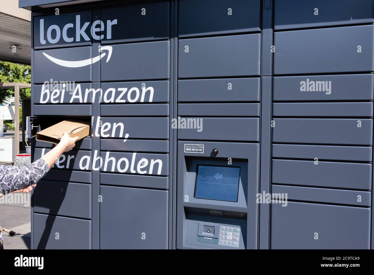 Amazon Packstation (locker), where customers can pick up their order themselves. Partial landscape view diagonally from the right. Stock Photo