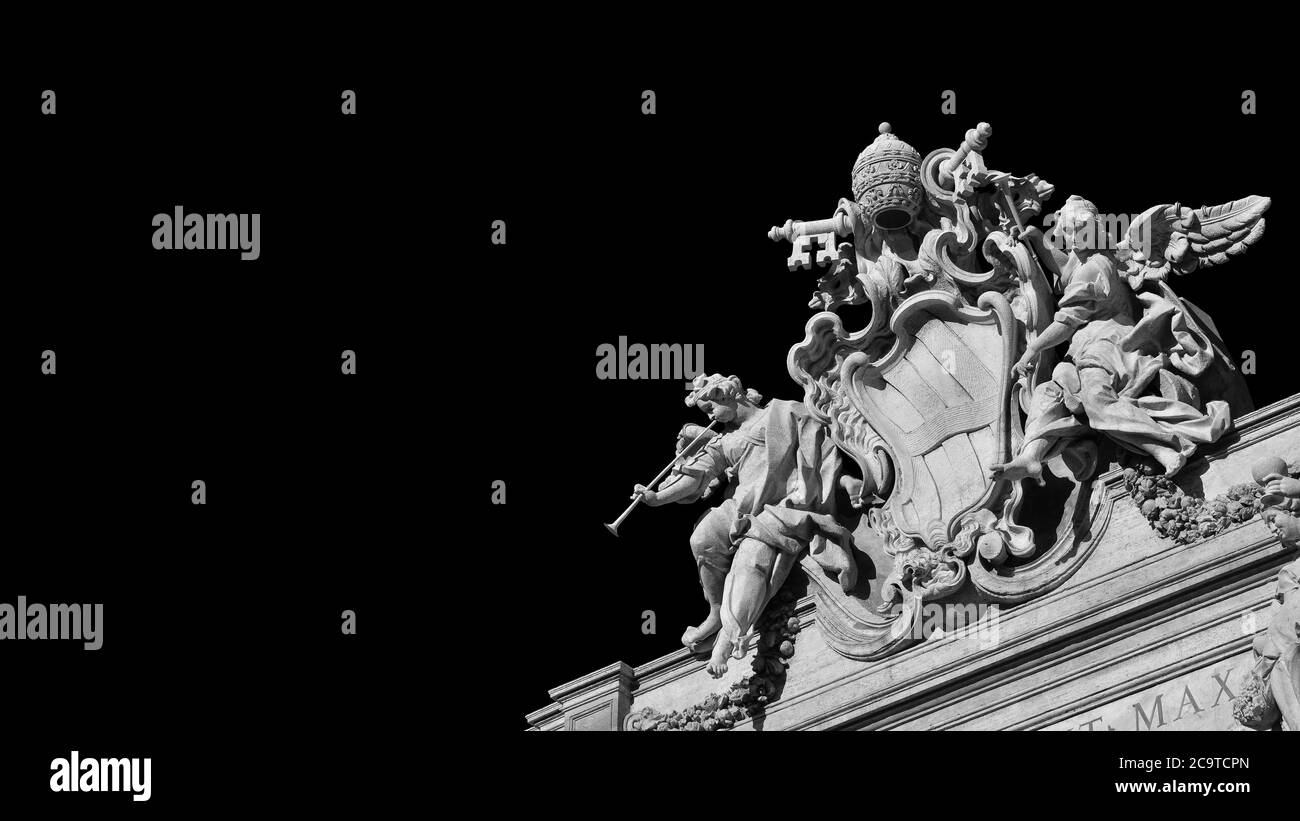 Baroque Art in Rome. Emblem of Pope Clement XII between angels with trumpets, at the top of the beautiful Trevi Fountain, 18th century (Black and Whit Stock Photo