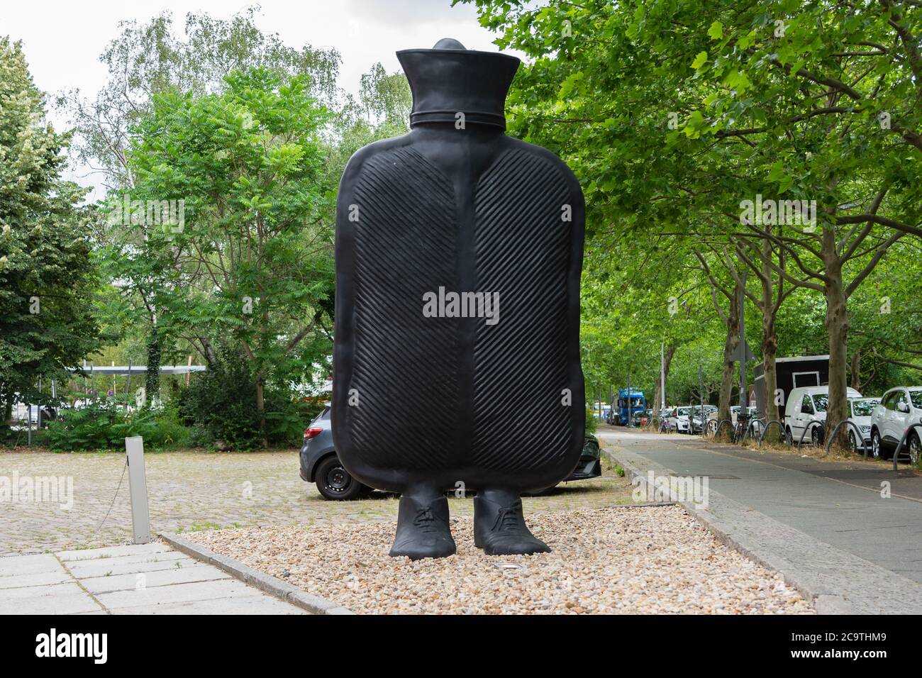 Giant hot water bottle on feet called "Big Mother" Front view in landscape format Stock Photo
