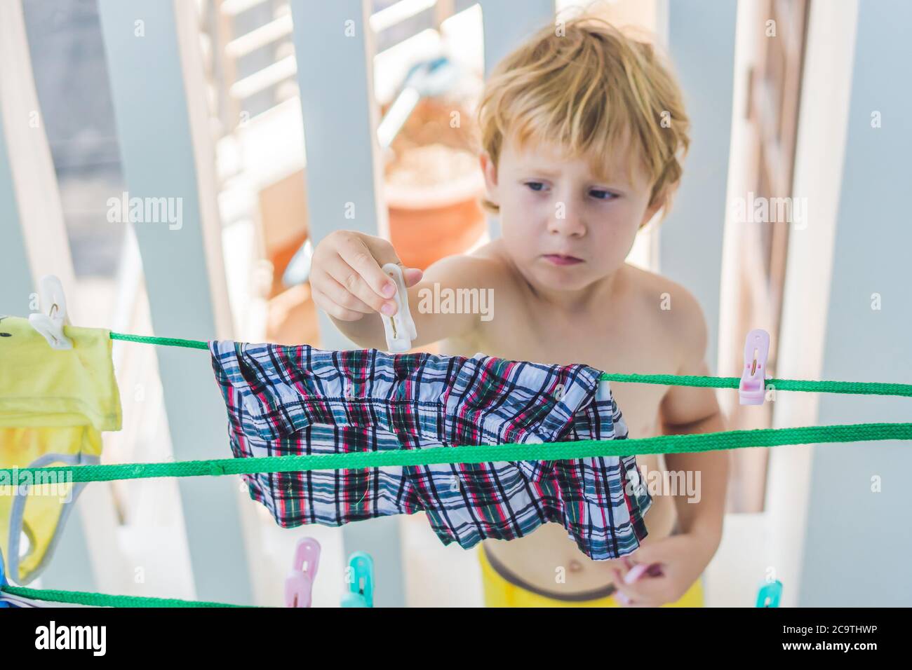 Hang up clothes hi-res stock photography and images - Alamy