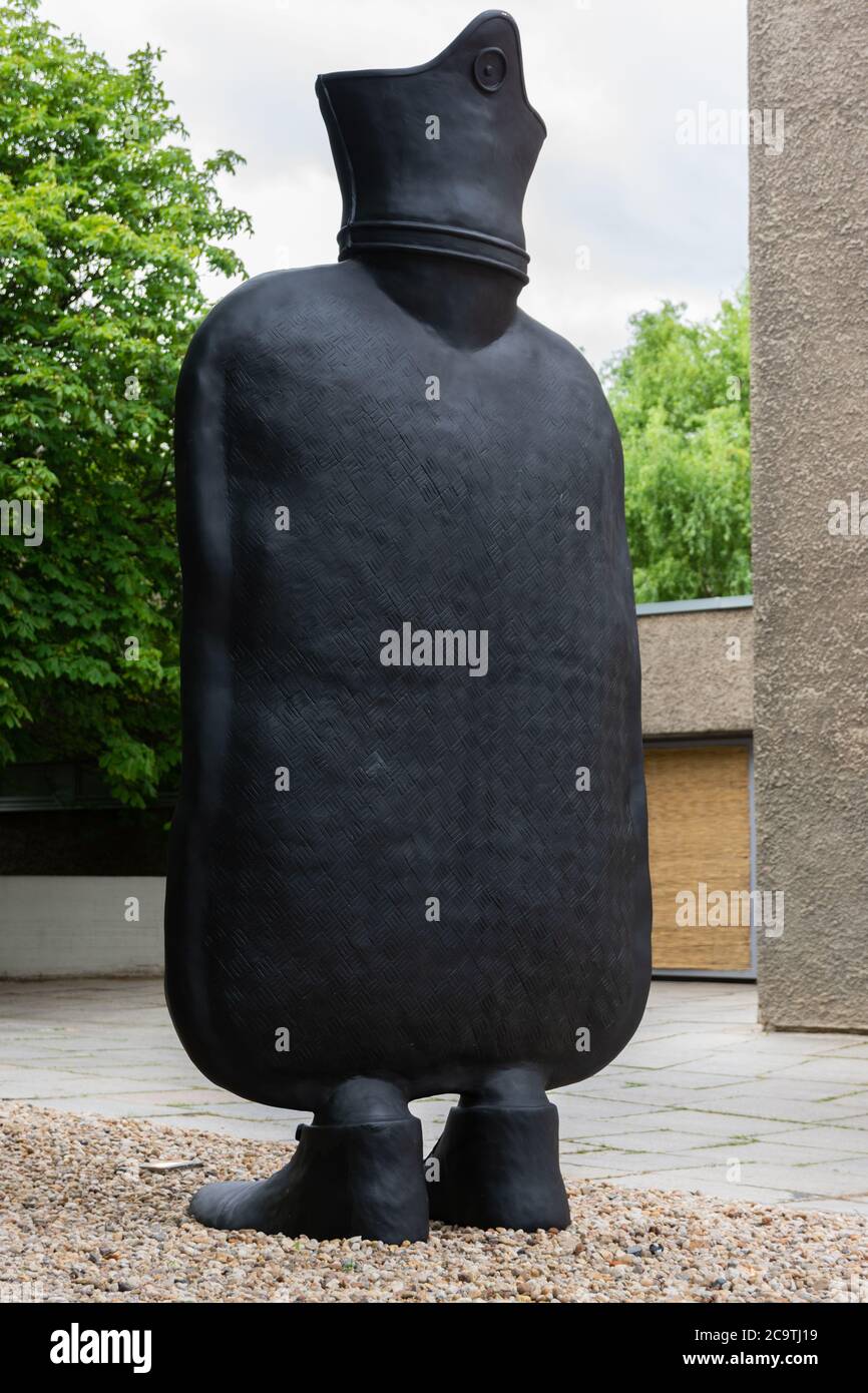 Giant hot water bottle on feet called 'Big Mother' Portrait oblique view from behind Stock Photo
