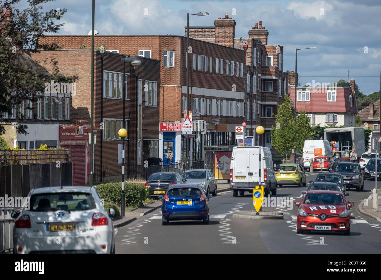 Suburban traffic and mixed architecture in Morden, Surrey Stock Photo