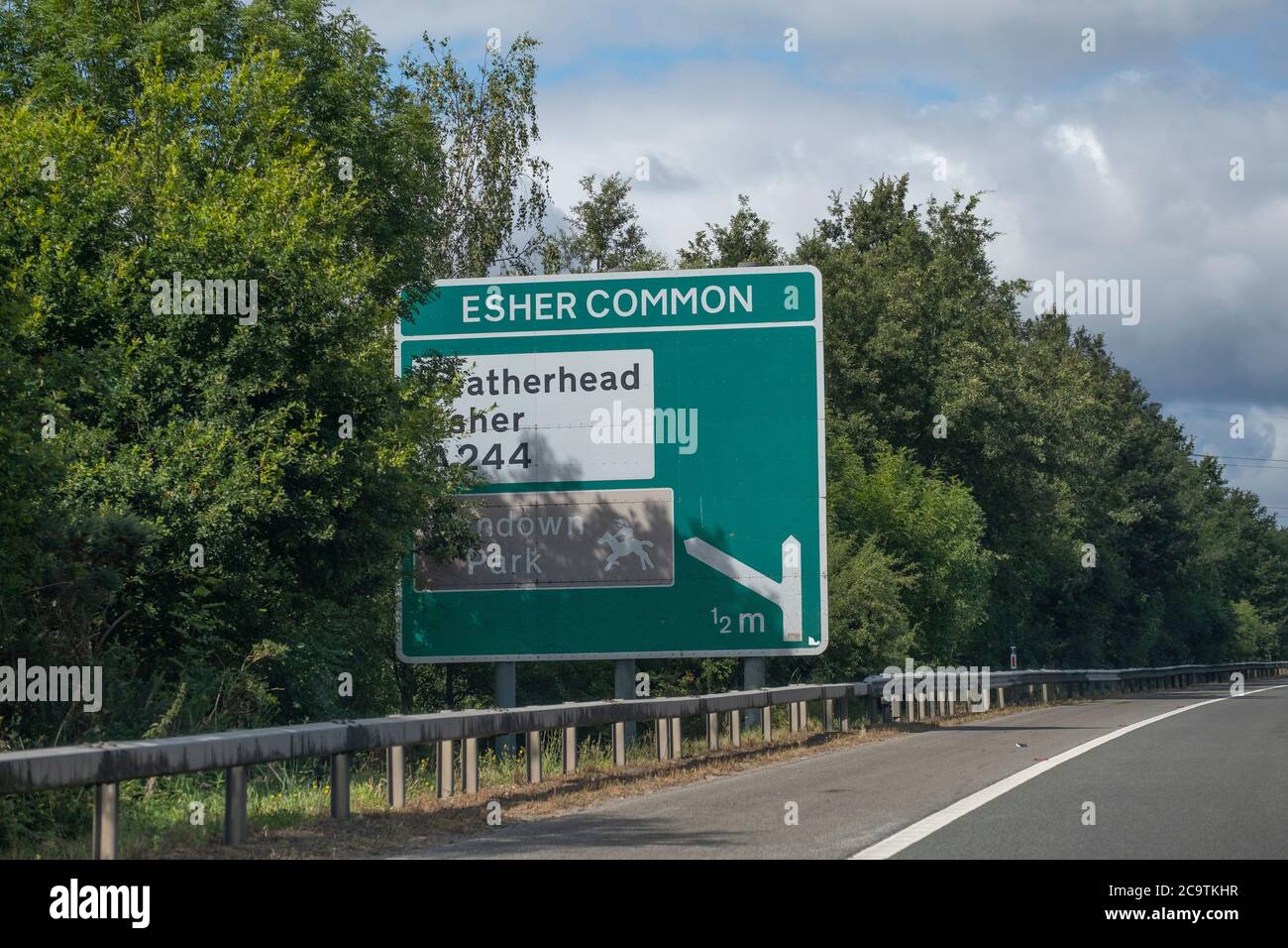 Partially obsured route signs on the A3 dual carriageway in Surrey, England, August 2020 Stock Photo