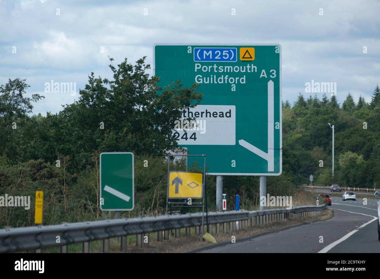 Partially obsured route signs on the A3 dual carriageway in Surrey, England, August 2020 Stock Photo
