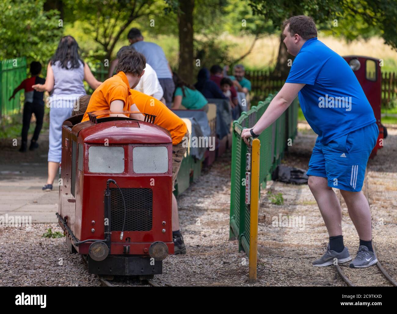 Watford, Hertfordshire, UK. 2 August 2020. Narrow gauge railway in Cassiobury Park, the largest public open space in Watford, attracts Sunday visitors Stock Photo