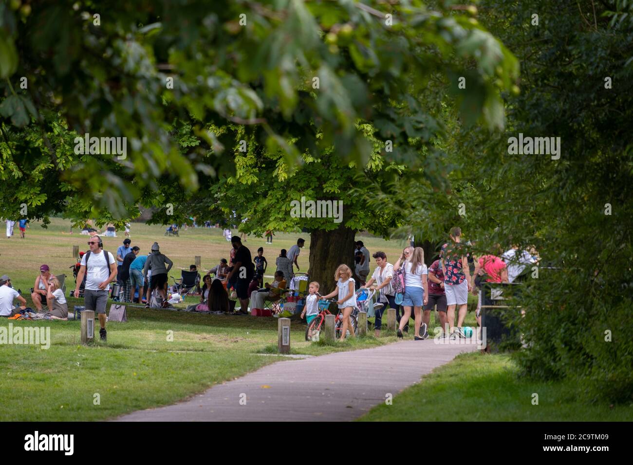 Watford, Hertfordshire, UK. 2 August 2020. Busy Sunday afternoon of picnics in Cassiobury Park, the largest public open space in Watford. Stock Photo