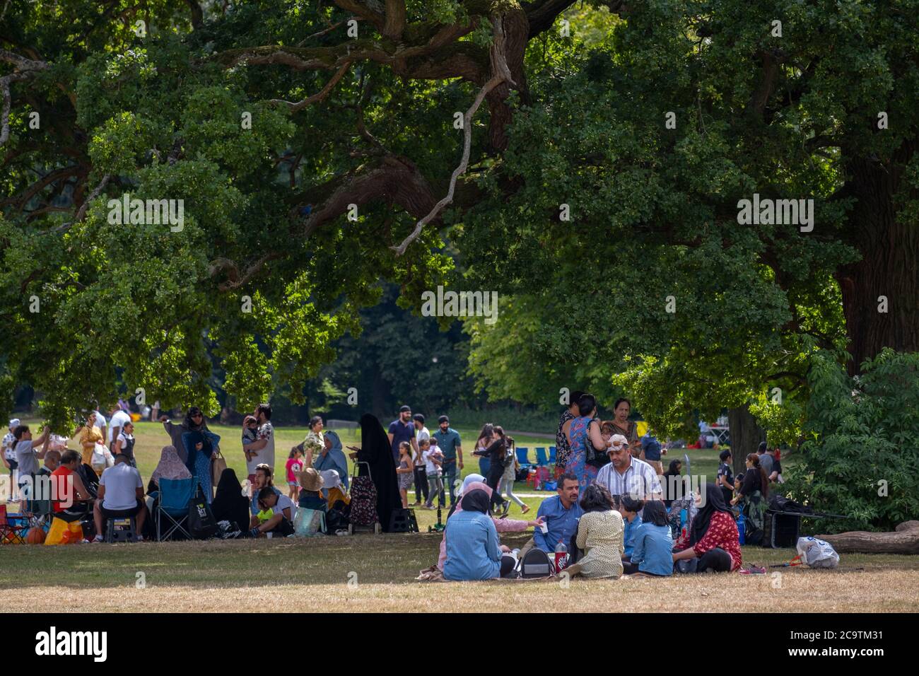 Watford, Hertfordshire, UK. 2 August 2020. Busy Sunday afternoon of picnics in Cassiobury Park, the largest public open space in Watford. Stock Photo