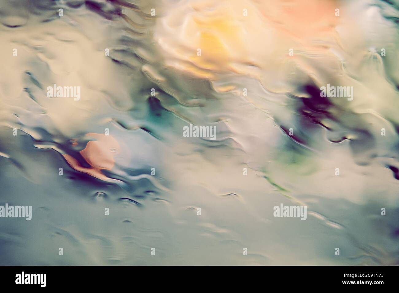 Clean water flows over the surface of the glass Stock Photo