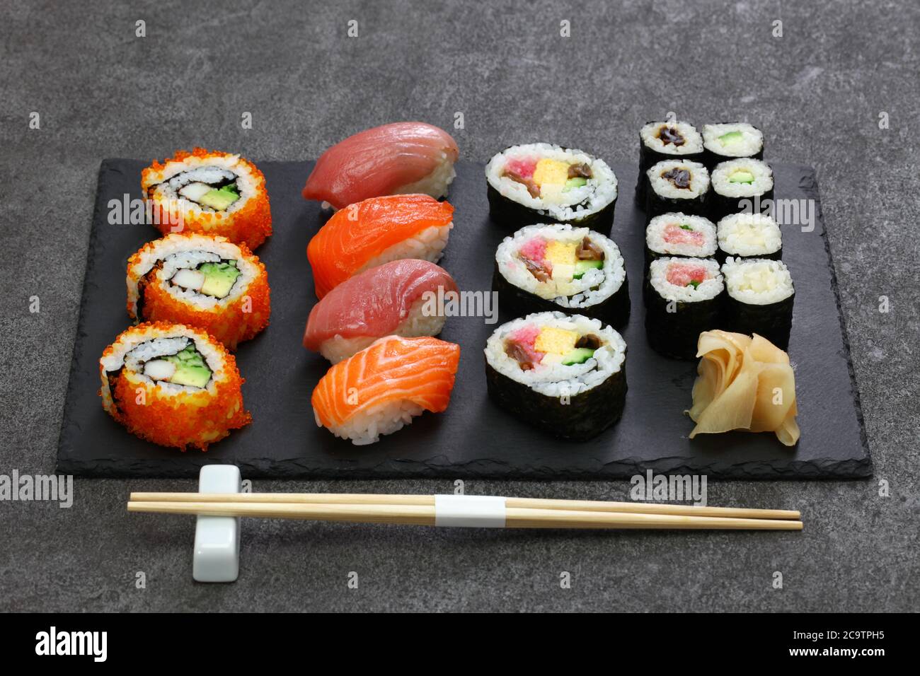 japanese sushi assorted : california rolls, maguro(tuna), salmon,  futomaki(sushi burrito), negitoro(minced tuna roll), takuan(pickled daikon  radish Stock Photo - Alamy