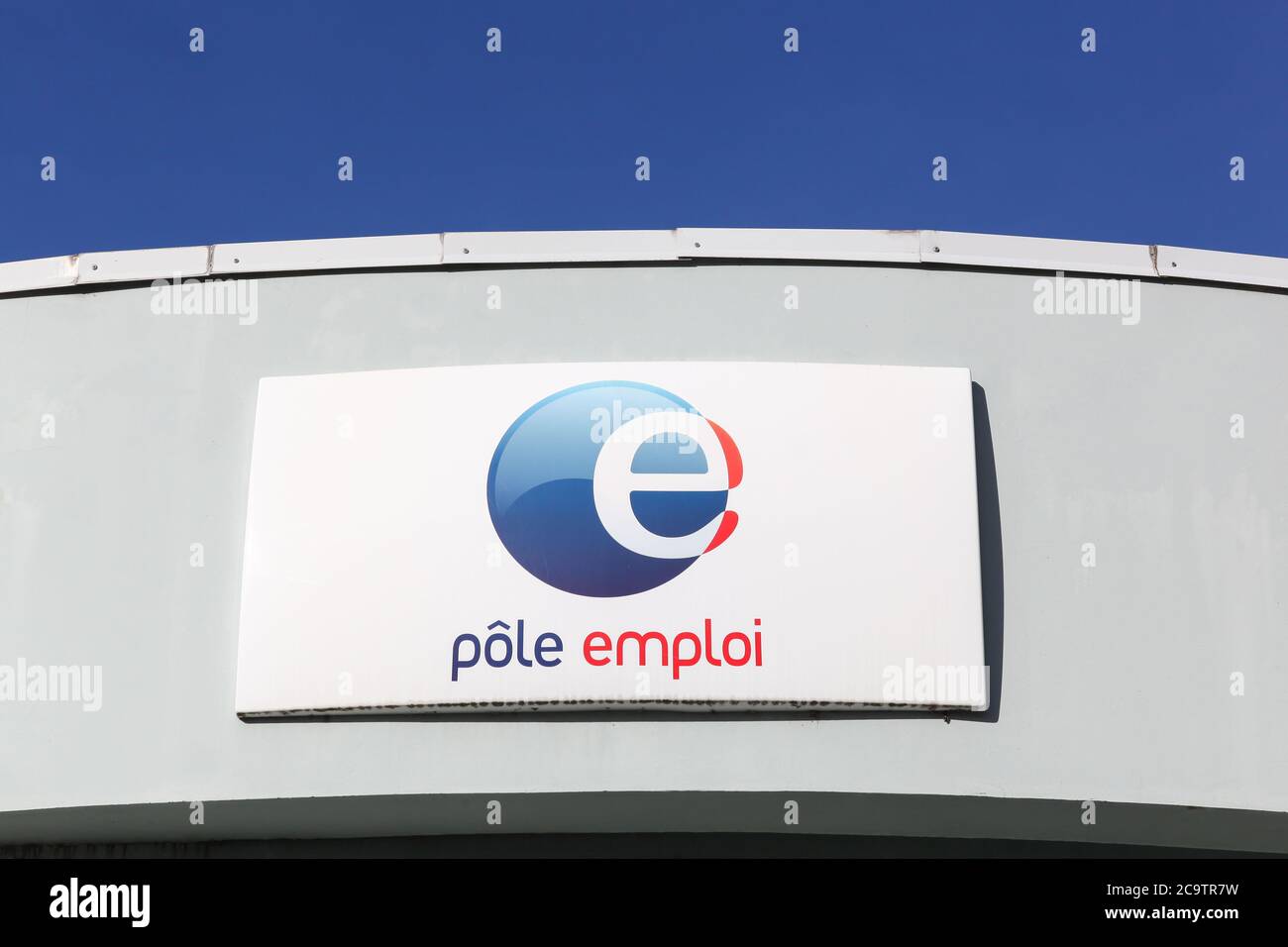 Neuville, France - March 14, 2018: Pole emploi logo on a wall. Pole emploi is a French governmental agency which registers unemployed people Stock Photo