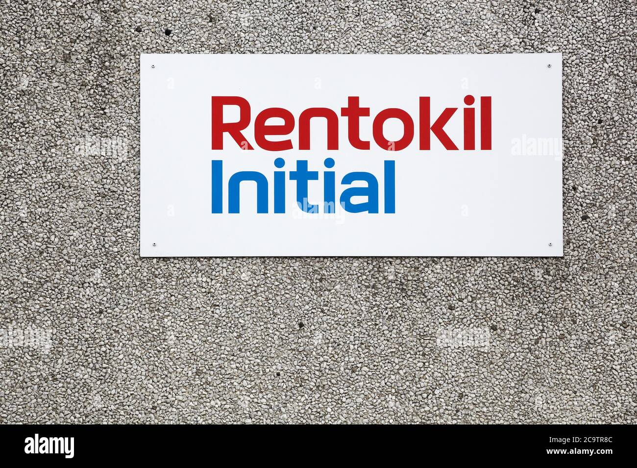 Ega, Denmark - July 25, 2020: Rentokil Initial logo on a wall. Rentokil Initial is a British business services group and specialized in hygiene Stock Photo