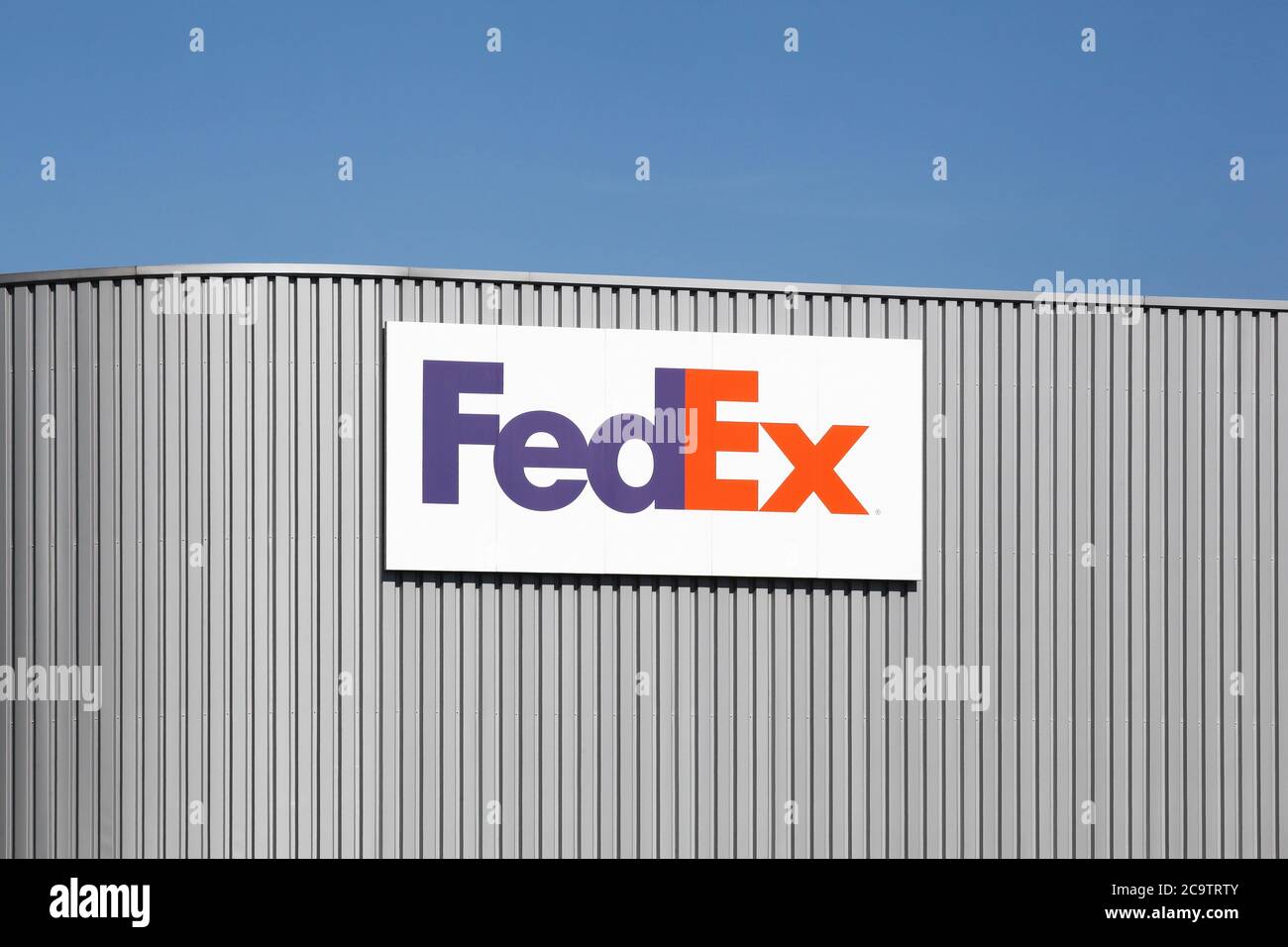 Voreppe, France - September 13, 2019: FedEx warehouse. FedEx Corporation is an American global courier delivery services company Stock Photo