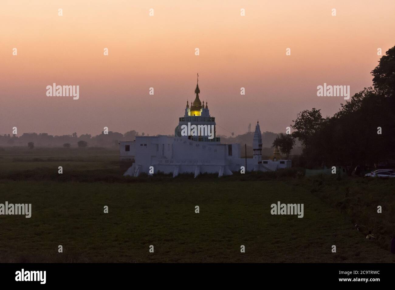 White Temple at Taung Tha Man Lake While Sunrise Near U-Bein Bridge, Mandalay, Myanmar, Asia Stock Photo