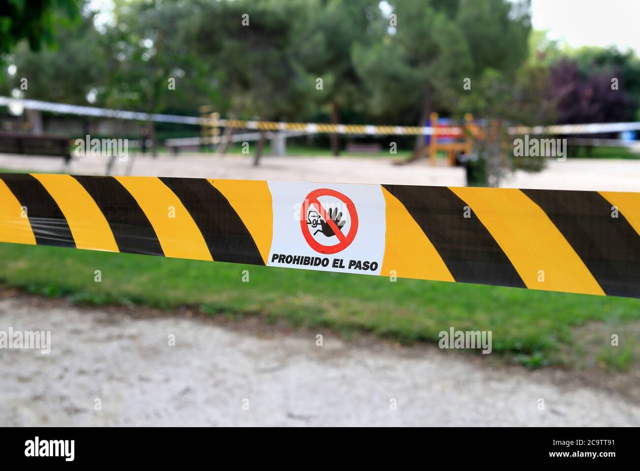 Madrid, Spain - June 5, 2020: The parks remain closed during the Covid-19 pandemic. Text translation: Prohibido el paso - Forbidden passage Stock Photo