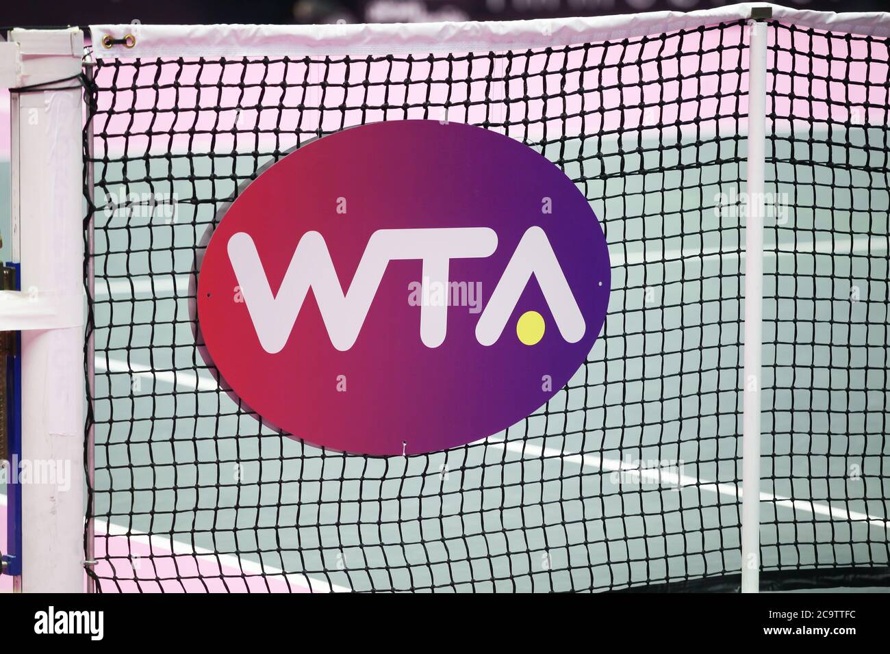 Lyon, France - March 6, 2020: WTA logo on a net. WTA is the principal organizing body of women's professional tennis Stock Photo