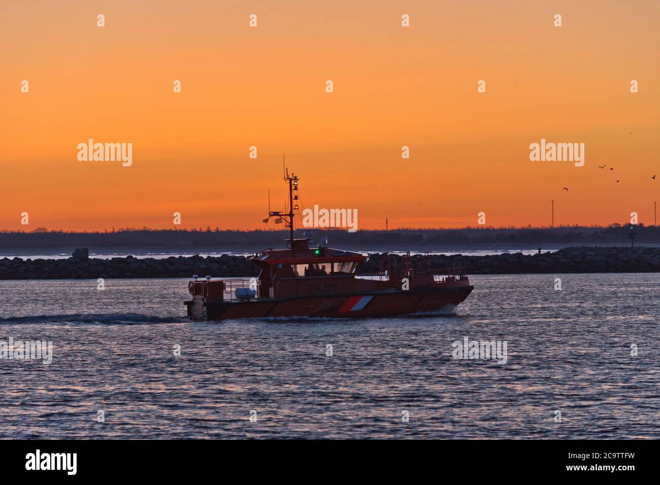 Boat at Warnemünde Port While Sunrise, Rostock, Baltic Sea, Mecklenburg Western Pomerania, Germany, Europe Stock Photo