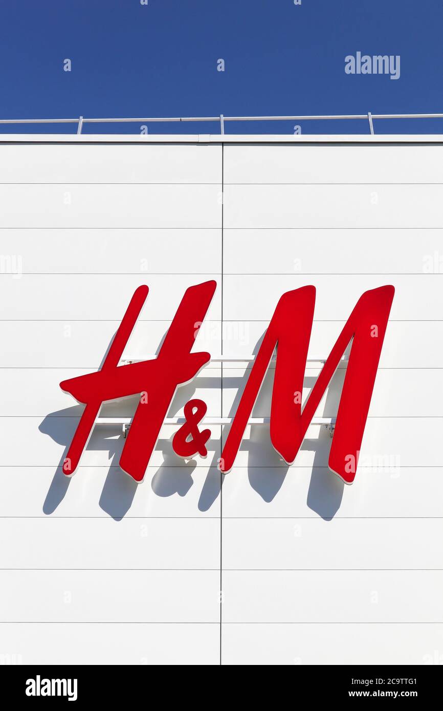 Creches, France - May 28, 2020: H & M logo on a facade. H & M is a swedish multinational retail clothing company, known for its fast fashion clothing Stock Photo