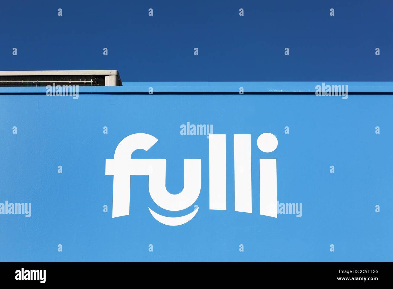 Drace, France - March 8, 2020: Fulli logo on a wall. Fulli is a low cost gasoline brand on APRR highways in France Stock Photo