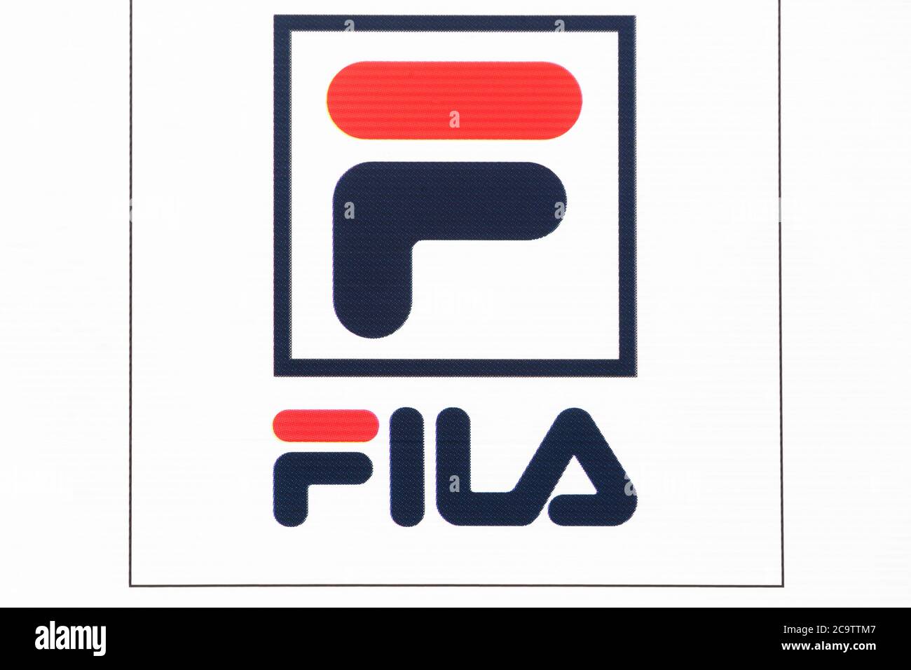 Villefranche, France - March 8, 2020: Fila logo on a wall. Fila is a sportswear manufacturer that designs shoes and apparel Stock Photo -