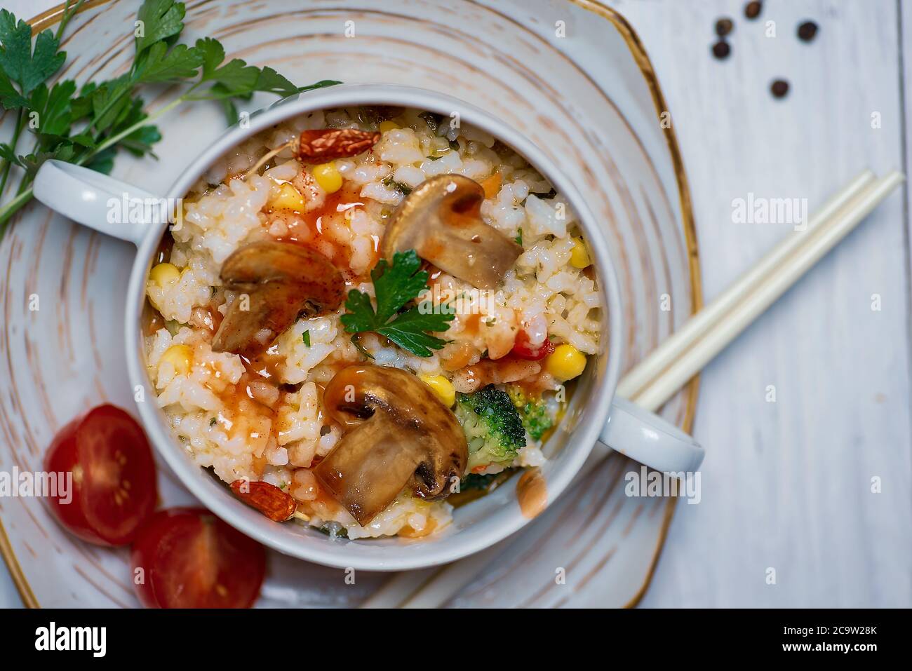 Homemade vegetarian risotto with mushrooms and vegetables on a plate Stock Photo