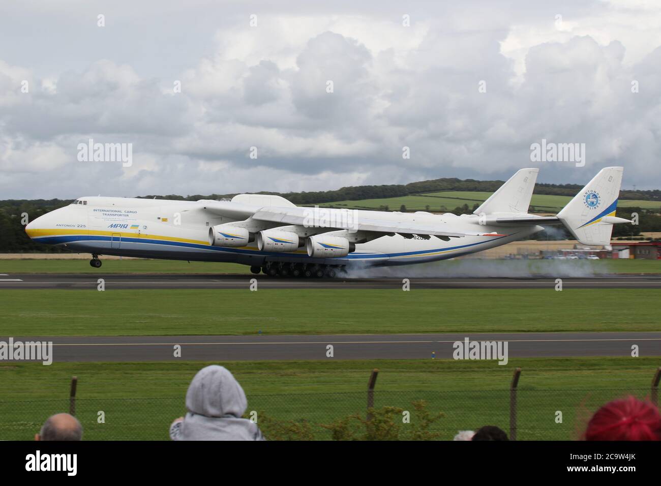 The largest plane in the world, the Antonov An-225 Mriya, stops off for refuelling at Prestwick International Airport in Ayrshire, Scotland. The aircraft, currently the only one of its kind completed, was initially built to transport the Buran space shuttle, and then served in the Soviet military as a strategic airlifter. It is now operated by Antonov Airlines to transport oversized loads, and today's visit was a scheduled fuel stop after departing Bangor earlier this morning. It then left Prestwick to continue its journey to Chateauroux in France. Stock Photo