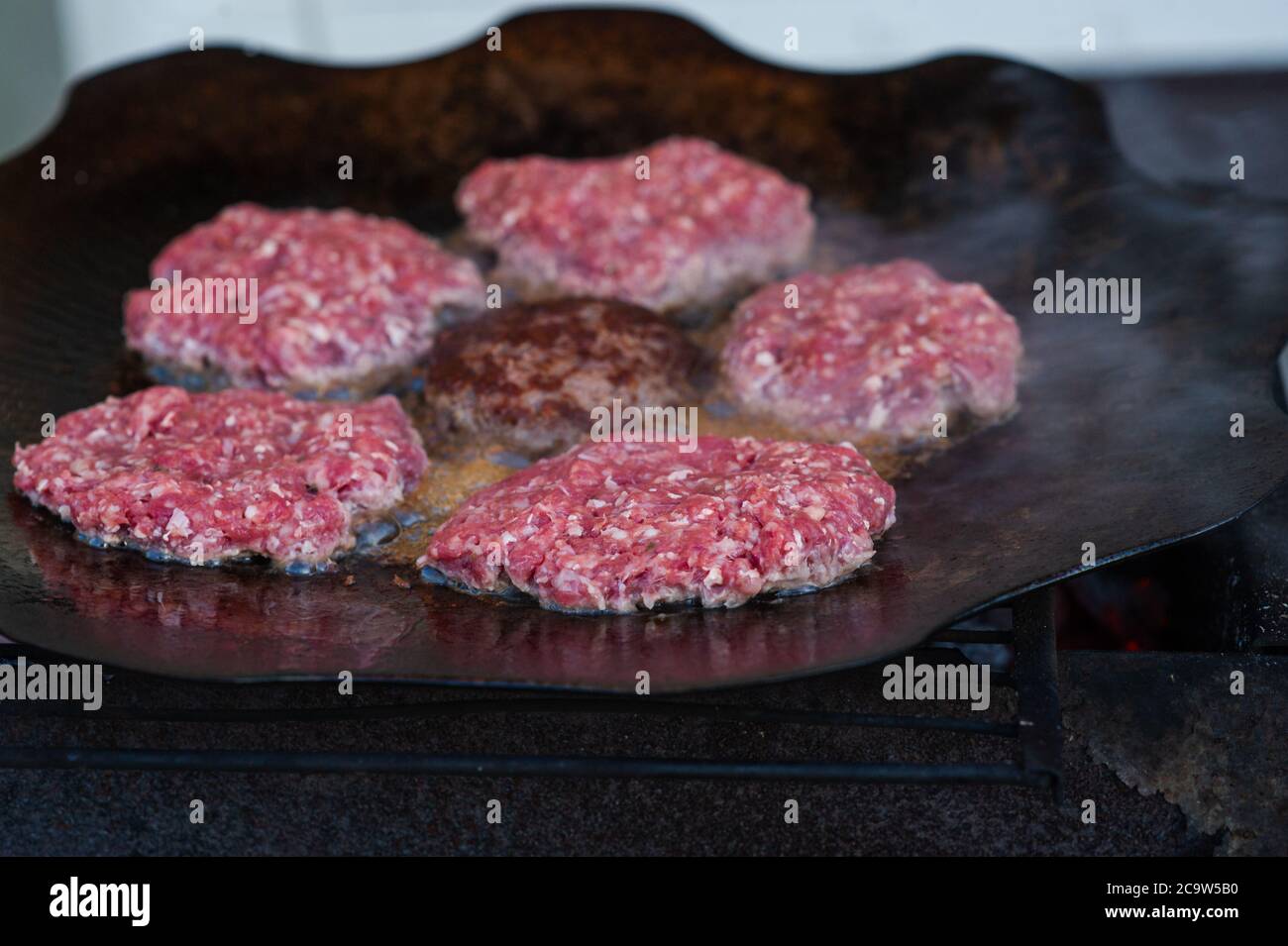 Burger Grilling on Fire.Homemade Hamburgers. Grill Meatballs. Making Hamburgers on a Grill