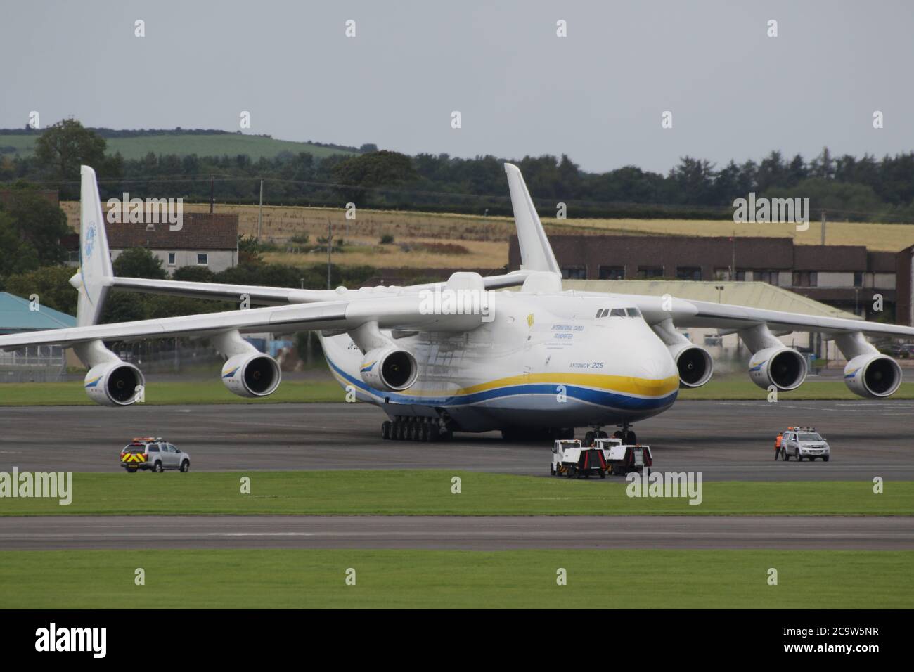 The largest plane in the world, the Antonov An-225 Mriya, stops off for refuelling at Prestwick International Airport in Ayrshire, Scotland. The aircraft, currently the only one of its kind completed, was initially built to transport the Buran space shuttle, and then served in the Soviet military as a strategic airlifter. It is now operated by Antonov Airlines to transport oversized loads, and today's visit was a scheduled fuel stop after departing Bangor earlier this morning. It then left Prestwick to continue its journey to Chateauroux in France. Stock Photo