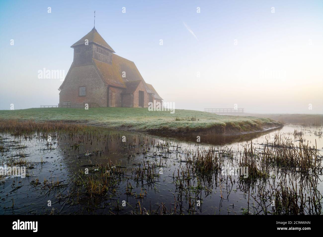 St Thomas à Becket Church in Fairfield at sunrise after the fog moved in. Stock Photo