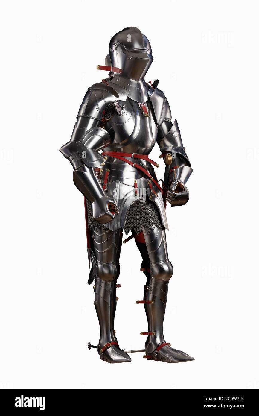 Mannequin man with a beard in a helmet and armor of a knight posing on a black background Stock Photo