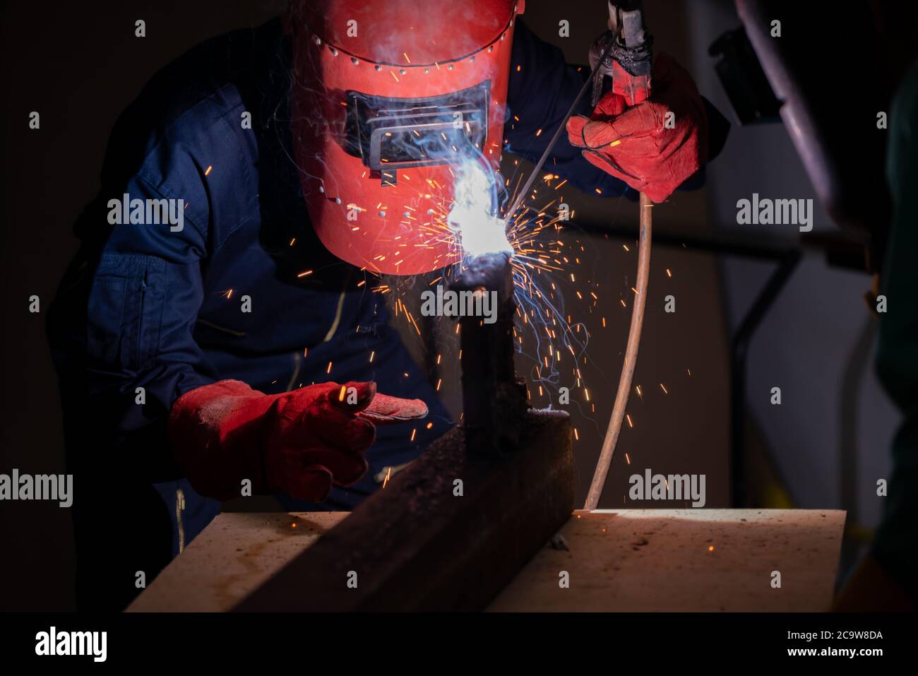 Metal welding steel works using electric arc welding machine Stock