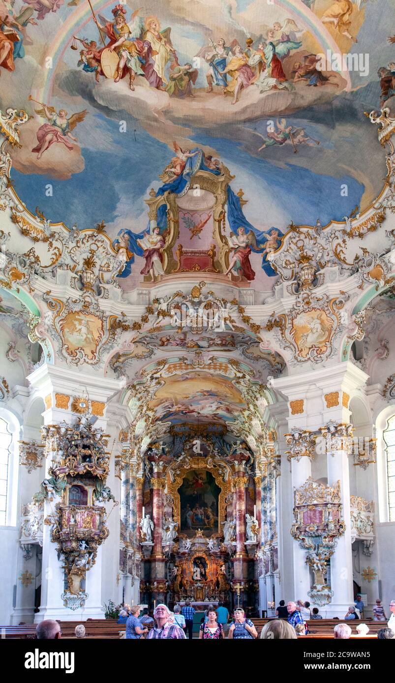 Although painted on a flat ceiling, the interior of the handsome, history Wieskirche in Bavaria appears to be a vault. Stock Photo