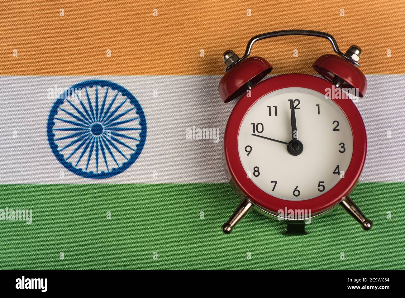 Flag of India and the old alarm clock. Traveling to India. Time to
