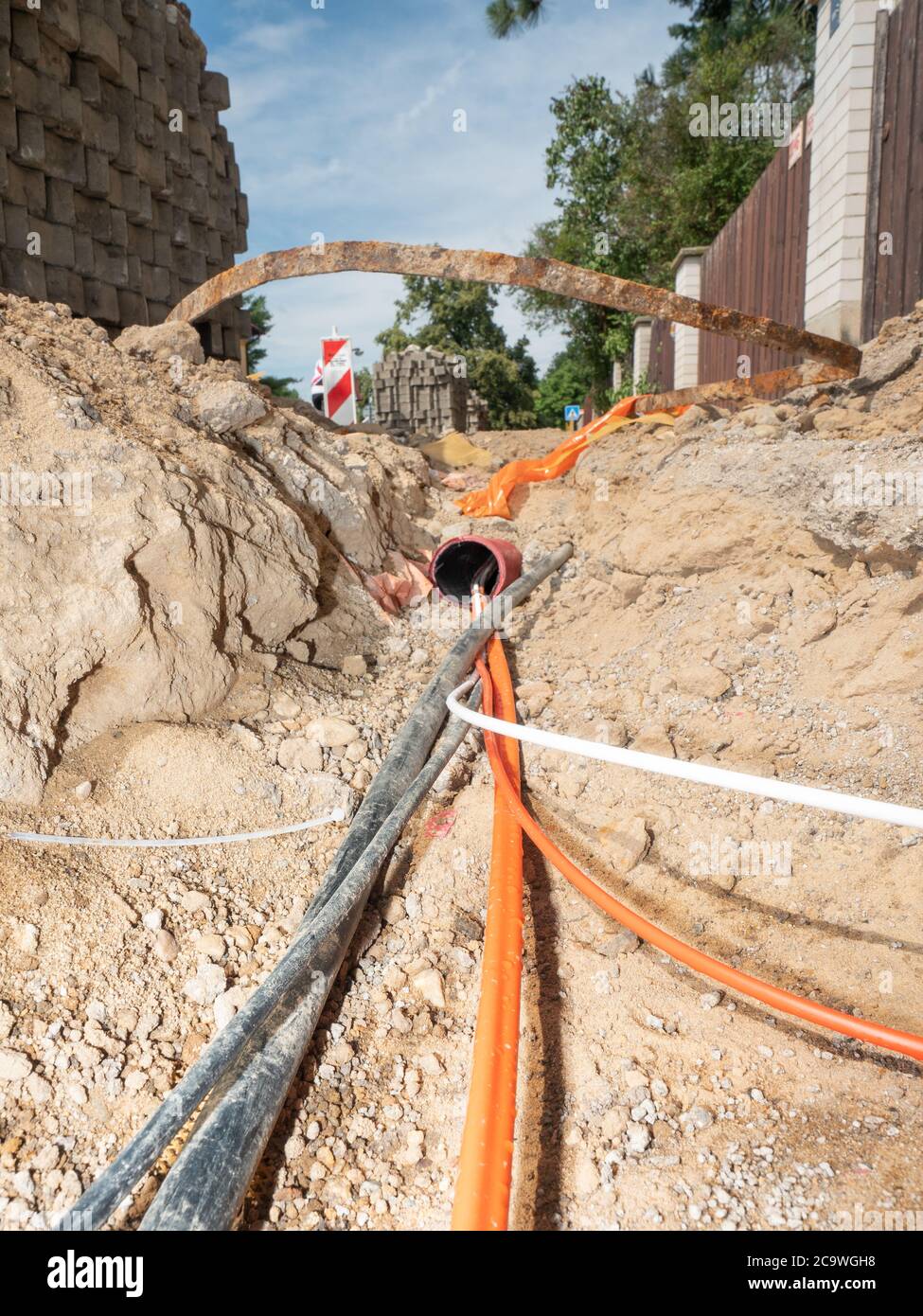 Orange fiber optic cables on a construction site. Building of lines of